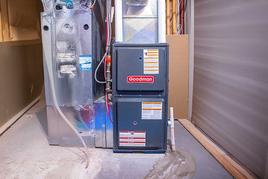 Goodman furnace and water heater installed in a utility room